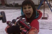Girl holds a bundle of energy drinks