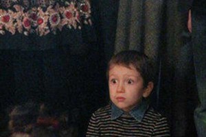 A boy in shock after Putin speaks to him