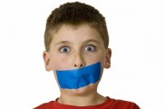 Boy with mouth taped shut