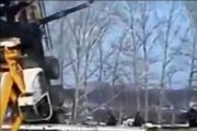 A crane crashes over an edge