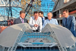 David Cameron and Vladimir Putin look at a mock-up of one of the arenas.